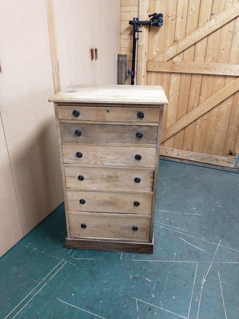 Tall six-drawer chest with a dull, worn finish, before refinishing